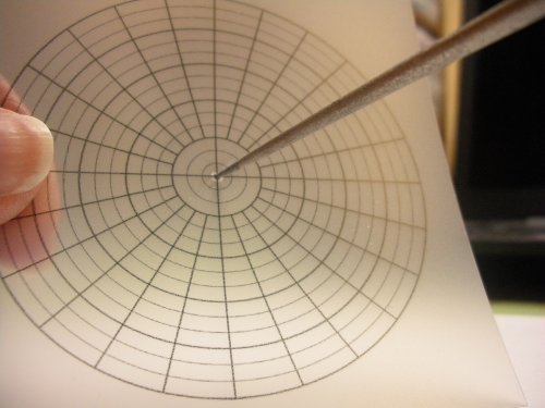 Judy Larson's How to Find and Mark the Center of a Disc. - , Wire Jewelry Design, Design, Tools, Use the tip of a bead reamer to make a very small hole